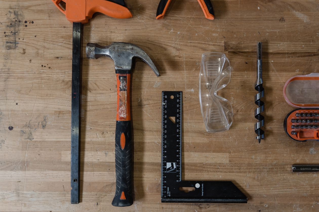 A tidy workbench with hand tools laid out for the job